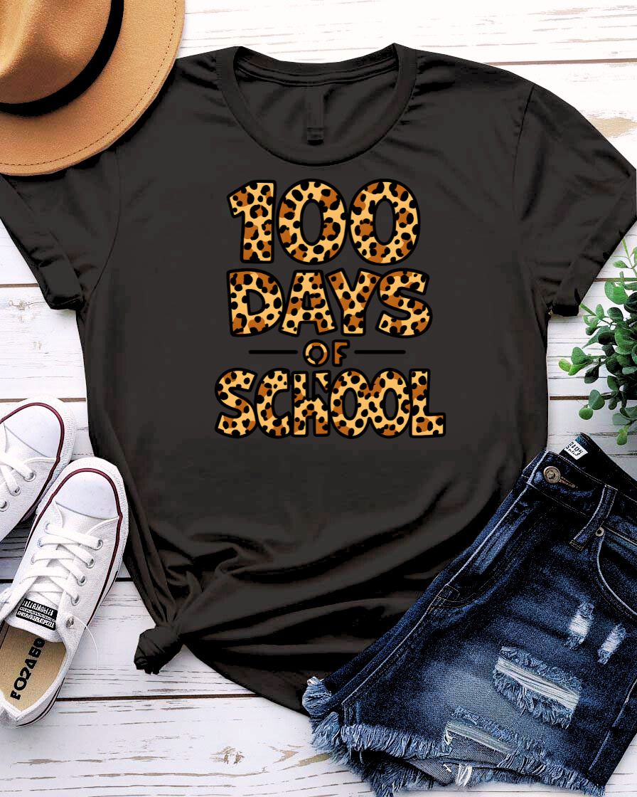Kids 100 Days of School t-shirt in green camo with bright orange text