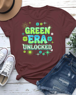 Green Era Unlocked St. Patrick's Day Tee with shamrock progress bar on model