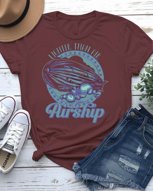 Air Ship Tee with vintage zeppelin drifting through clouds on model