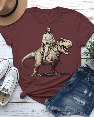 Jesus at T-Rex t-shirt featuring a classical painting of Jesus with a Tyrannosaurus