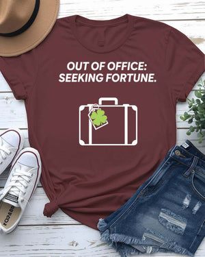 Out of Office Seeking Fortune St. Patrick's Day Tee with shamrock laptop on model
