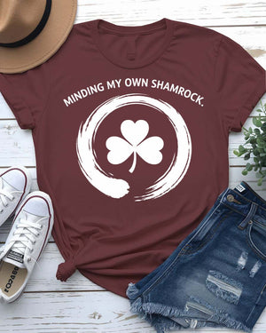 Minding My Own Shamrock St. Patrick's Day Tee with peaceful shamrock on model