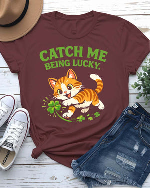 Catch Me Being Lucky St. Patrick's Day Tee with leprechaun hiding behind clover on model
