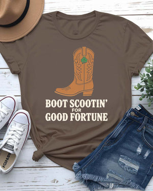 Boot Scootin' St. Patrick's Day Tee with dancing boots and shamrock trails on model