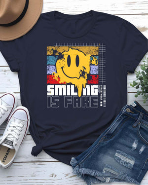 Smiling is Fake urban tee with cracked porcelain smile graphic on model