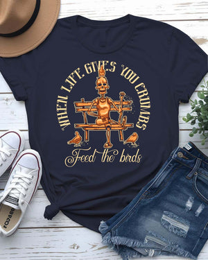 Feed The Bird T-Shirt with hand offering seeds to sparrow on model