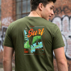 LA Surf Streetwear Tee with surfboard at sunset on model