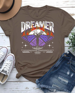 Dreamer Streetwear T-Shirt with silhouette and paper airplane graphic on model