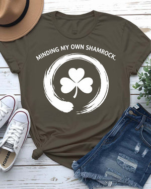 Minding My Own Shamrock St. Patrick's Day Tee with peaceful shamrock on model