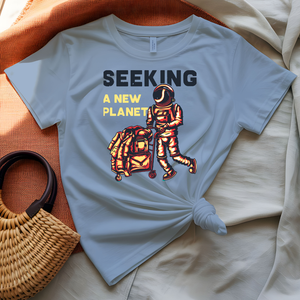 Seeking a New Planet astronaut drifting toward distant world graphic tee on model