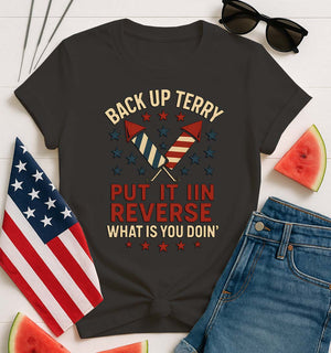 Backup Terry 4th of July Funny Tee by Memez Store – black T-shirt with bold white “Put it in reverse, Terry” meme text and fireworks art.