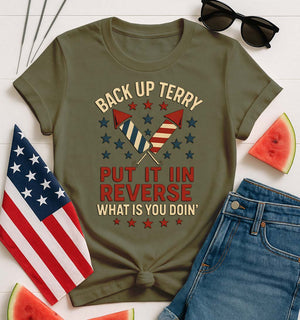 Backup Terry 4th of July Funny Tee by Memez Store – black T-shirt with bold white “Put it in reverse, Terry” meme text and fireworks art.