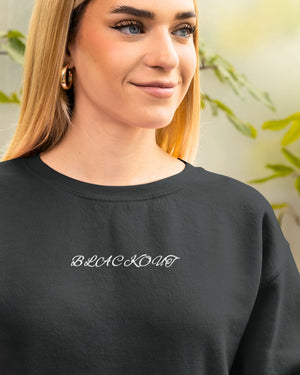 "Unisex Blackout Halloween Sweatshirt styled outfit"