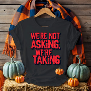Black unisex t-shirt with bold white text “We Are Not Asking, We Are Taking” by Memez Store – protestwear meets meme culture