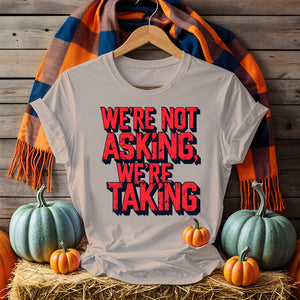 Black unisex t-shirt with bold white text “We Are Not Asking, We Are Taking” by Memez Store – protestwear meets meme culture