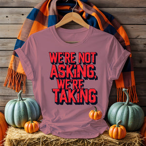 Black unisex t-shirt with bold white text “We Are Not Asking, We Are Taking” by Memez Store – protestwear meets meme culture