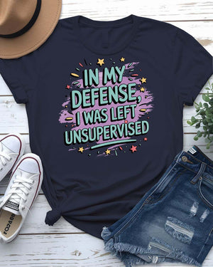 Bold text design meme tee with “In My Defense I Was Left Unsupervised”