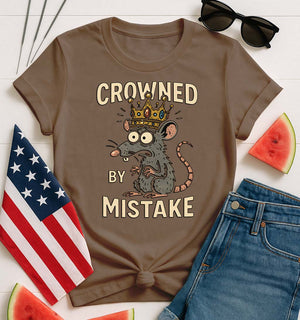 Crowned by Mistake Funny Tee by Memez Store – black t-shirt with cartoon crown graphic and meme text.
