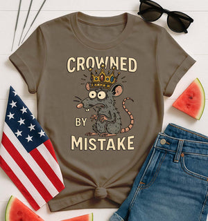 Crowned by Mistake Funny Tee by Memez Store – black t-shirt with cartoon crown graphic and meme text.