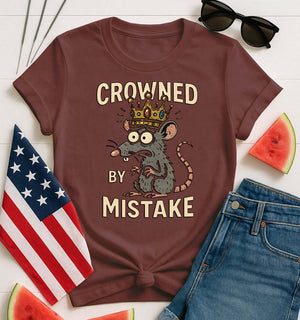 Crowned by Mistake Funny Tee by Memez Store – black t-shirt with cartoon crown graphic and meme text.