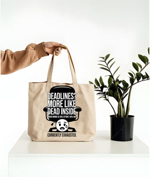 Deadlines Is More Like Dead Inside canvas tote bag with bold black‑humor typography by Memez Store