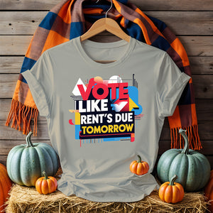 Front-facing Vote Like Rent’s Due Tomorrow tee on flat lay background