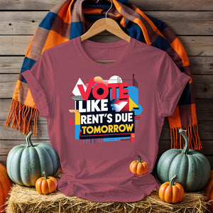 Front-facing Vote Like Rent’s Due Tomorrow tee on flat lay background