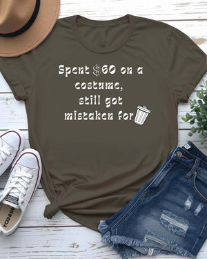 Funny Halloween shirt with bold text reading “Spent $60 on This Costume” in large, clean font on a black unisex tee.