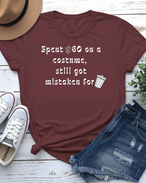 Funny Halloween shirt with bold text reading “Spent $60 on This Costume” in large, clean font on a black unisex tee.