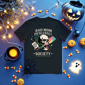 Funny “Rad Mom Pickleball” tee with bold lettering on unisex t-shirt shown on sporty mom holding a paddle.