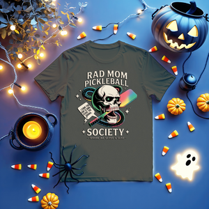 Funny “Rad Mom Pickleball” tee with bold lettering on unisex t-shirt shown on sporty mom holding a paddle.