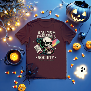 Funny “Rad Mom Pickleball” tee with bold lettering on unisex t-shirt shown on sporty mom holding a paddle.