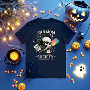 Funny “Rad Mom Pickleball” tee with bold lettering on unisex t-shirt shown on sporty mom holding a paddle.