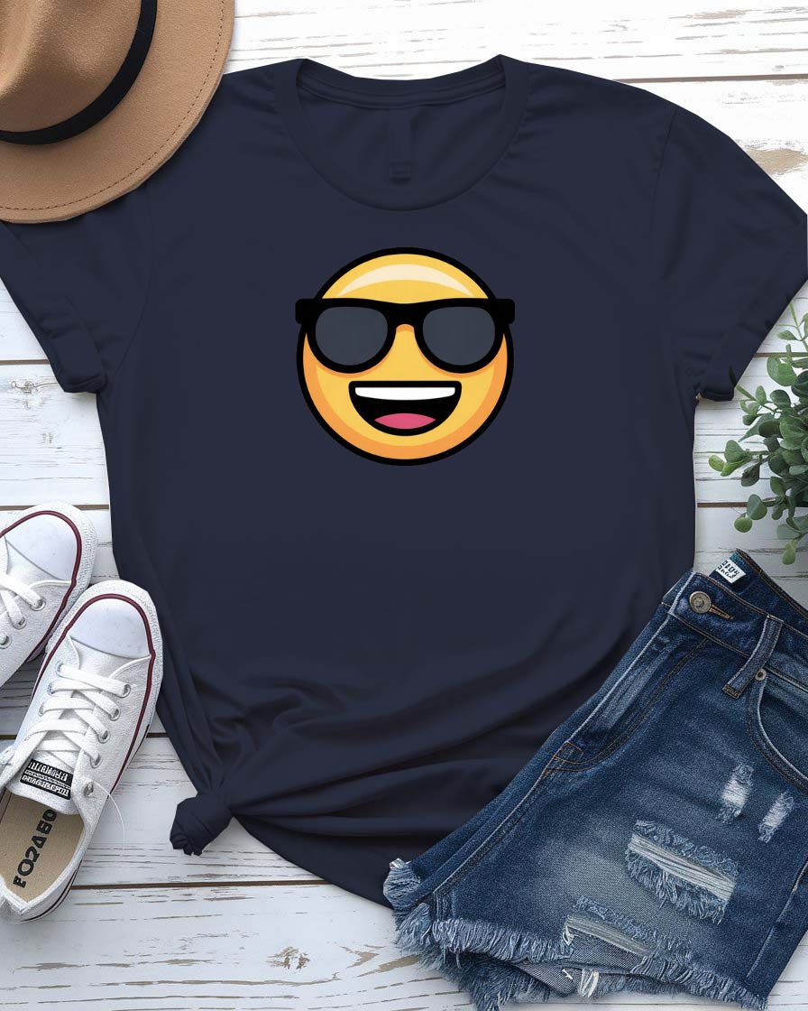 Funny emoji face wearing glasses printed in bold on a unisex t-shirt – shown on smiling model.