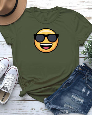 Funny emoji face wearing glasses printed in bold on a unisex t-shirt – shown on smiling model.