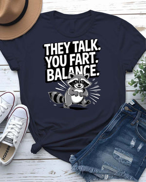 Funny text t-shirt that says “They Talked You Fart” in bold white letters on black unisex tee – modeled with a confused face expression.