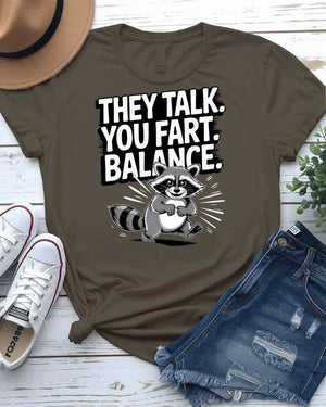 Funny text t-shirt that says “They Talked You Fart” in bold white letters on black unisex tee – modeled with a confused face expression.