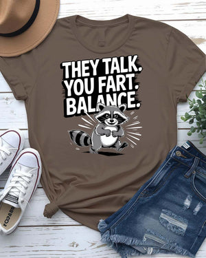 Funny text t-shirt that says “They Talked You Fart” in bold white letters on black unisex tee – modeled with a confused face expression.