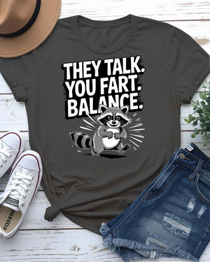 Funny text t-shirt that says “They Talked You Fart” in bold white letters on black unisex tee – modeled with a confused face expression.