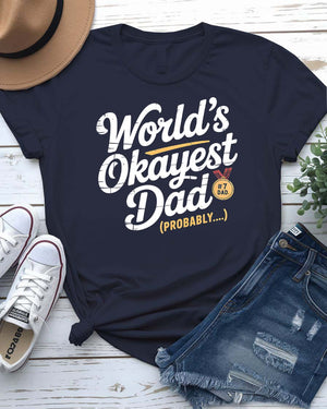 Funny unisex T-shirt featuring the bold typographic phrase “World’s Okayest Dad” in a clean, eye-catching font.
