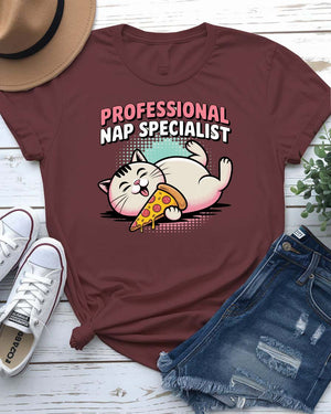 Funny unisex T-shirt with “Professional NAP Specialist” text and sleeping cat graphic from Memez Store