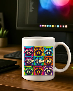 In My Feral Era Raccoon Mug – Funny ceramic coffee cup with chaotic raccoon meme design.