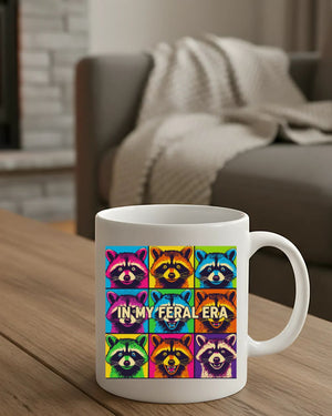 In My Feral Era Raccoon Mug – Funny ceramic coffee cup with chaotic raccoon meme design.