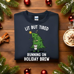“Lit But Tired Christmas Sweatshirt – funny holiday meme sweatshirt for exhausted coffee lovers, cozy unisex fleece pullover from Memez.Store.