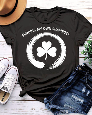 Minding My Own Shamrock St. Patrick's Day Tee with peaceful shamrock on model