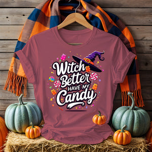 Model laughing in Funny Halloween Tee holding candy