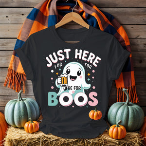 Model wearing “Just Here for the Boos” tee holding a drink at a Halloween party
