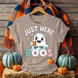 Model wearing “Just Here for the Boos” tee holding a drink at a Halloween party
