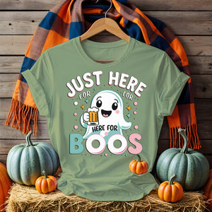 Model wearing “Just Here for the Boos” tee holding a drink at a Halloween party