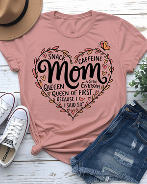 Mom wearing Snack & Caffeine Queen tee